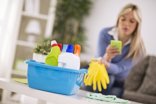 Professional cleaner washing shopfront windows in Brent